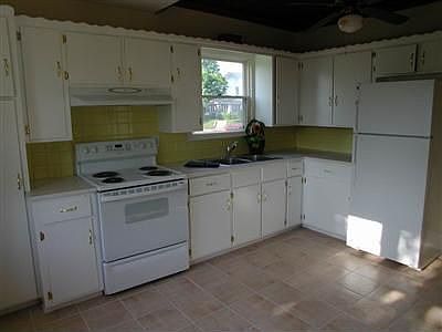 Updated kitchen with new appliances and ceramic tile floors