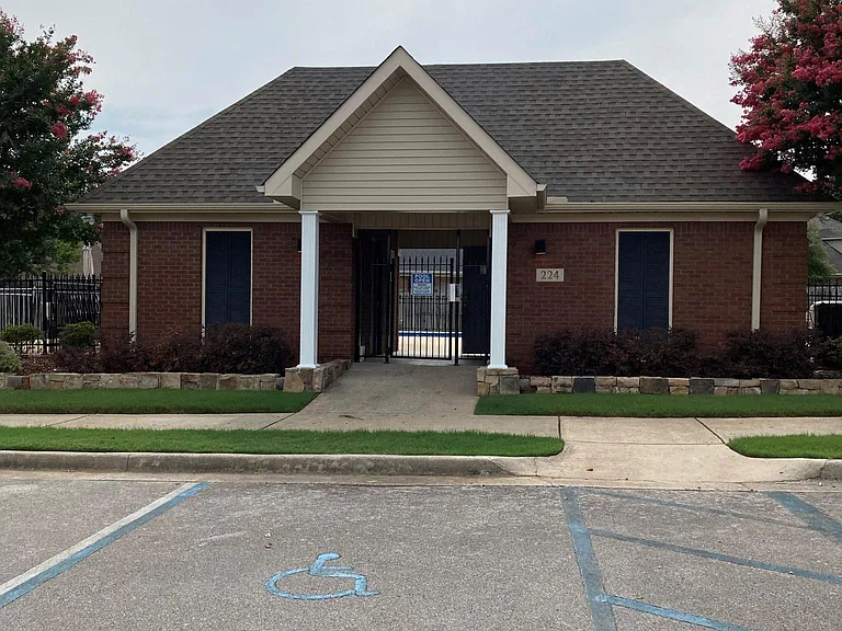 Pool entry building with restrooms
