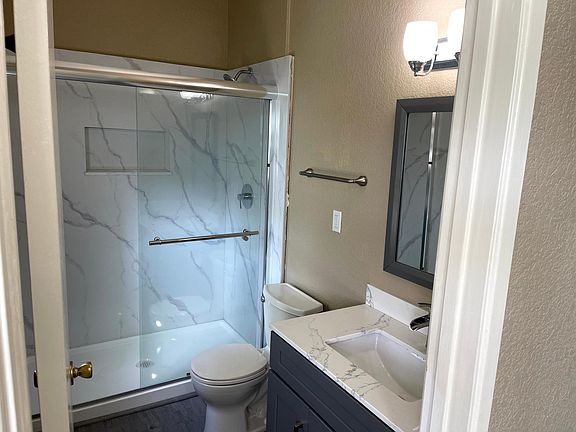 Newly remolded bathroom with marble walls in the bathroom