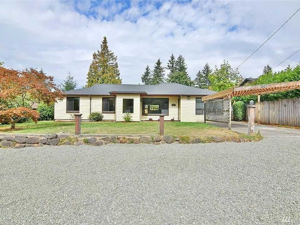 Home is nicely set back with ample parking; spaciously decep