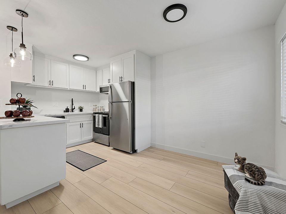 Adjoining open dining area is filled with natural light from the large window _ the perfect space for everyday living and entertaining.