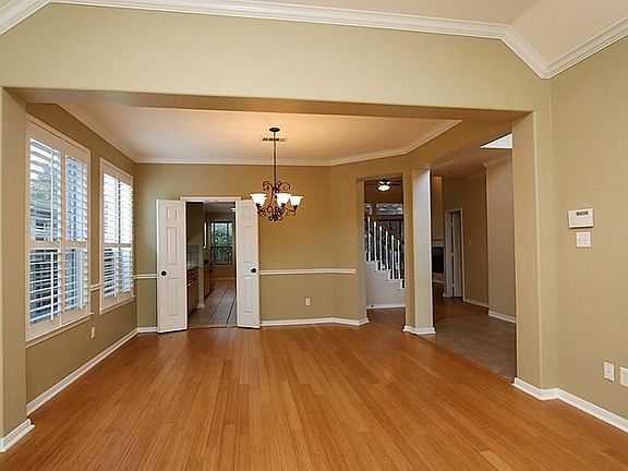 View from front looking into dining room with bamboo flooring.