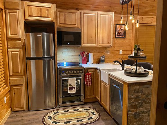 Full Kitchen
Cabinets , Ice maker refrigerator , stove ,microwave , dishwasher and vinyl flooring