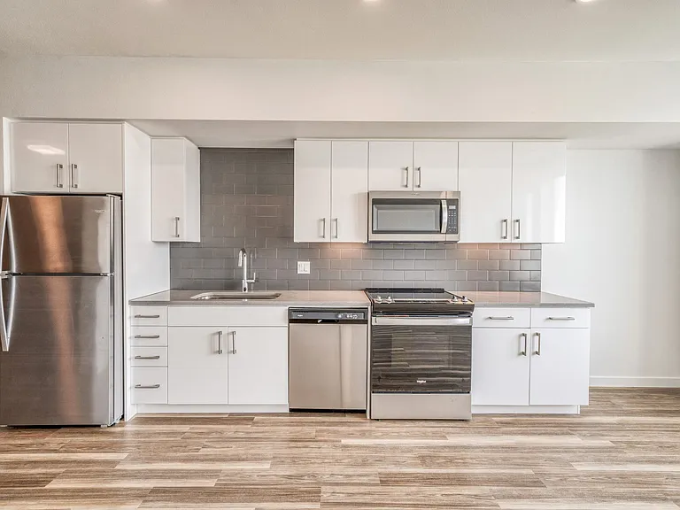 Sleek cabinets, modern appliances, and elegant finishes