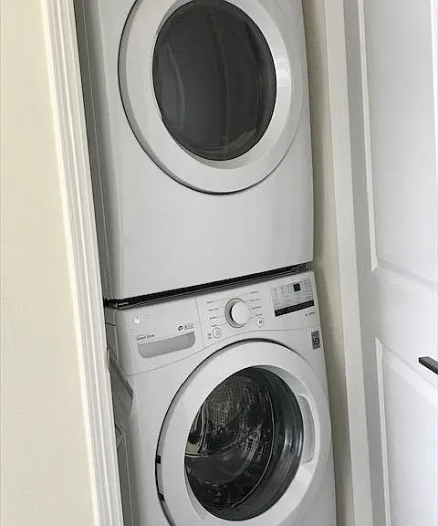 Stacked washer/dryer where most of the laundry is... by the bedrooms.
