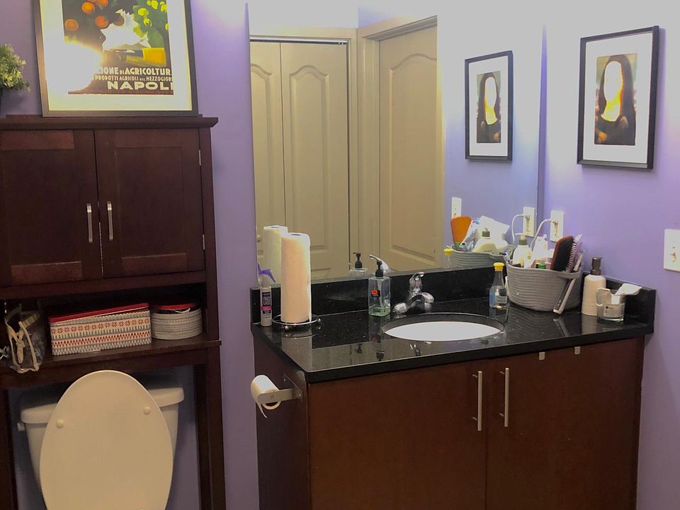 Bathroom - with tub, washer/dryer and walk-in closet.