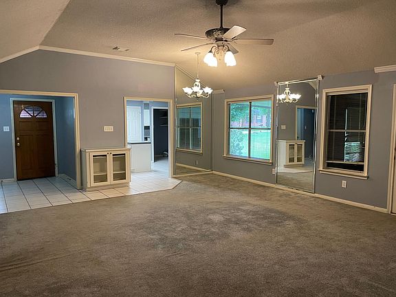 Looking across living room towards kitchen, laundry room is just beyond the kitchen.
