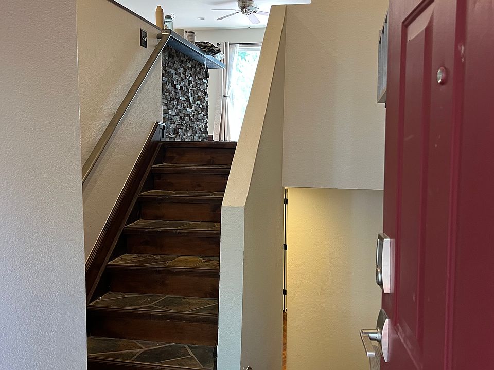 split level entry with built ins behind door, slate entry.