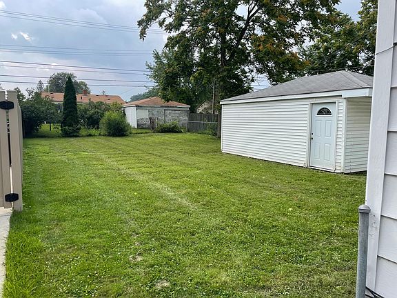 Spacious backyard with one and a half car garage!