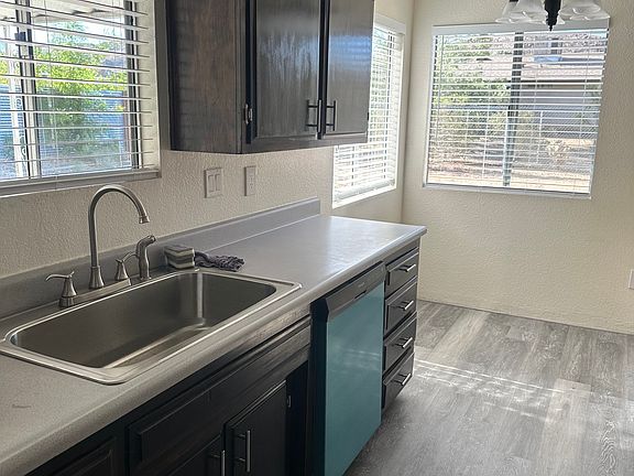 New sink, faucet and dishwasher and window coverings.