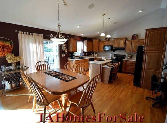 Dining Area with hardwood floors and sliding door to covered deck