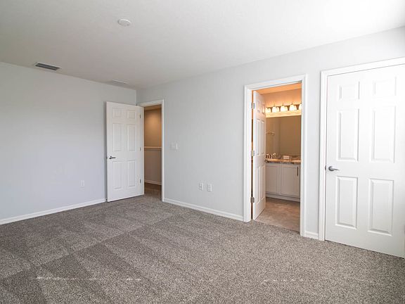 Spacious master suite with walk-in closet and en-s