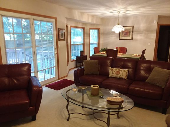 Great Room with Dining Room behind overlooking Deck