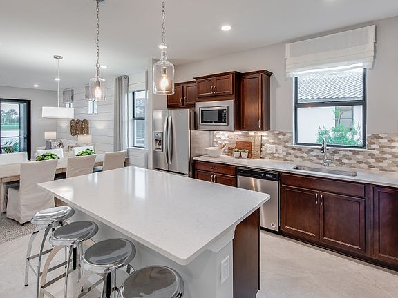 Kitchen with large center island and stainless steel appliances