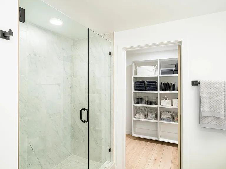 Spa-inspired finishes and smart storage solutions in this North Tower home _every detail shines.