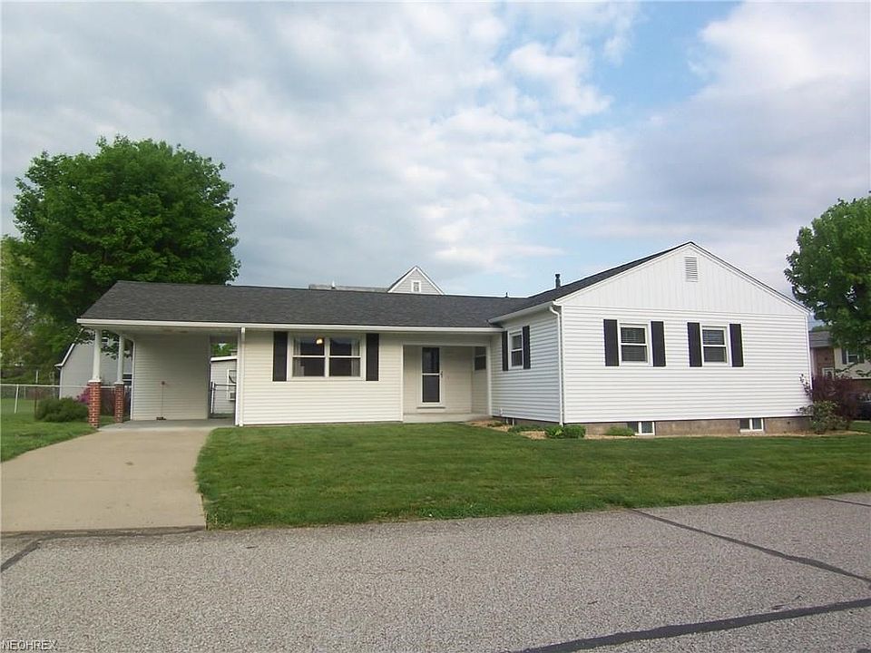 View of side showing carport & side porch.