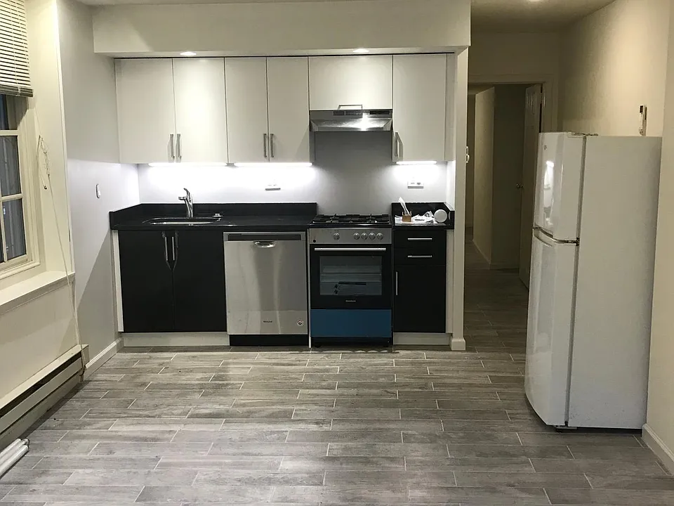 Main living/kitchen area looking toward hall & bedroom