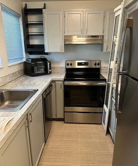 Kitchen with newer appliances.