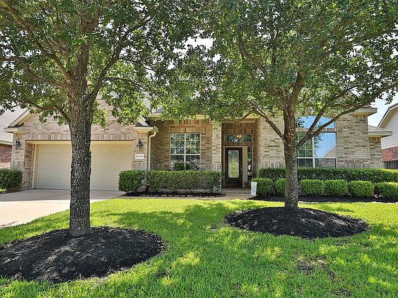 Mature trees offer optimum shade, full sprinklers system and brick on all four sides of the home.