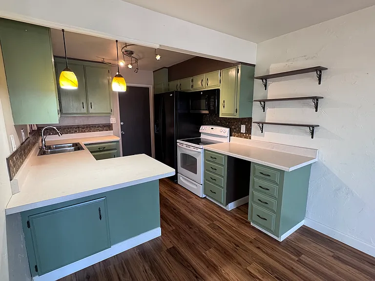Kitchen with refrigerator, stove, dishwasher, and R/O.