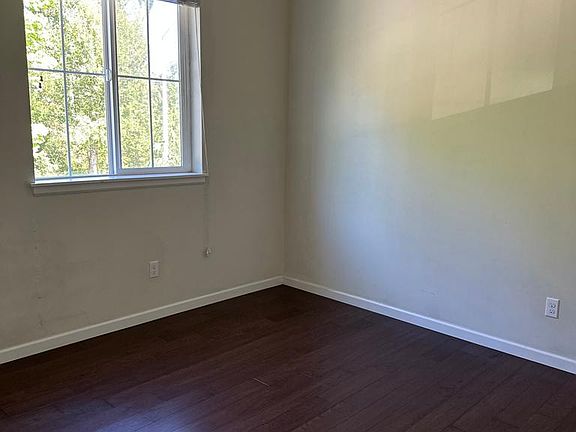 Main floor 4th bedroom with hardwood floor & full bath just across the hall