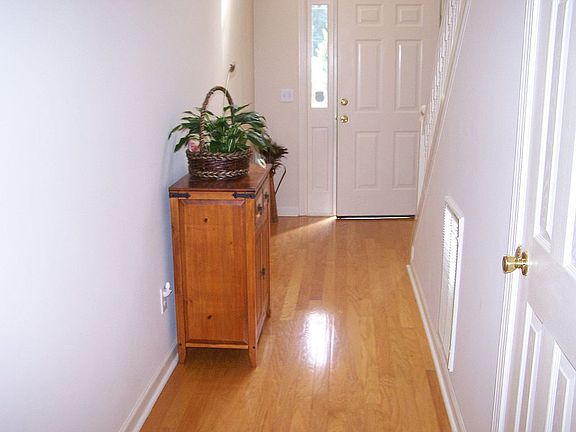 Foyer with hardwood flooring.
