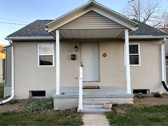 Front of house - to the right is a 2 story garage with a driveway