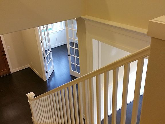 Stairs leading down to office room and front door