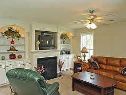 Family room with built-ins, surround sound prewire, ceiling fan