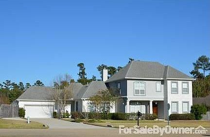 House on top of Hill : Beautiful curb appeal. Boat pad on left. Huge driveway.