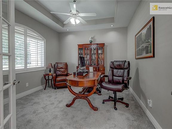 French doors to office or 4th bedroom.  Armoire is behind door for guest clothes. Box ceiling with light and fan.