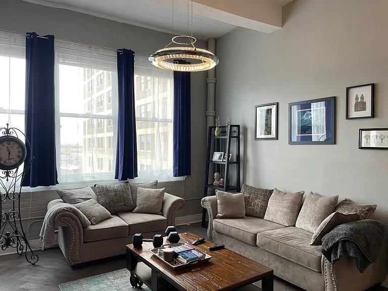 Living room shown with furnishings