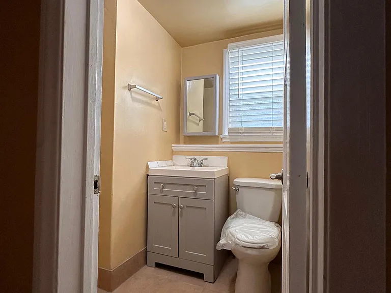 Bathroom with shower and tile flooring