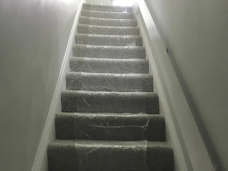 Staircase to 3rd floor. An abundance of natural light including a skylight over the hall.