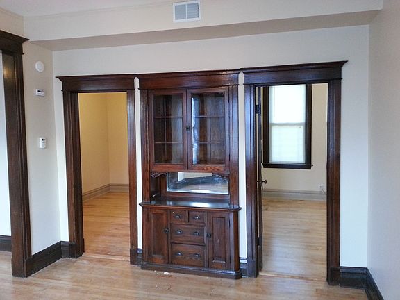 Dining room with built in hutch. Entrance to bedrooms on both sides of hutch.