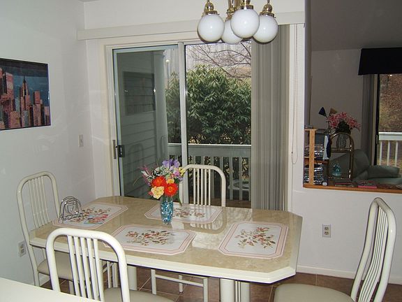 Eat-in kitchen with sliders to deck.