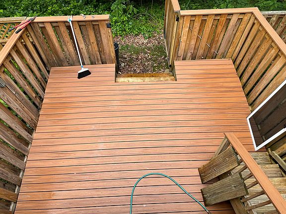 Trex lower rear deck with locking gate and access via walk out basement.