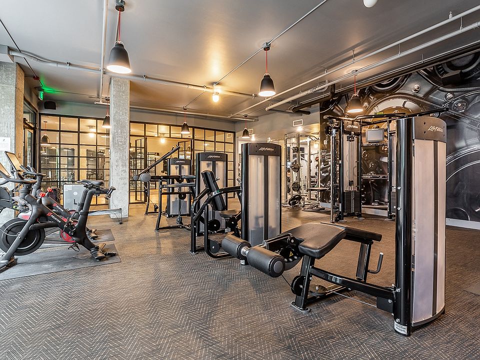 Community Gym with Weight Machines, Cardio Bikes, and Mirrors