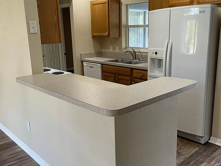Kitchen view with high counter top from living room