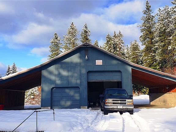 You are going to LOVE this garage/shop! Ample parking, RV garage door (13'8 high), utility sink, wood stove, upstairs loft area with room that could be turned into office space. 