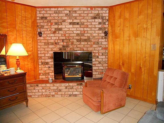 The fireplace visually anchors this family room and adds character! Ideal to warm up the room during