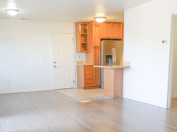 Dining area to the left, flows into kitchen.