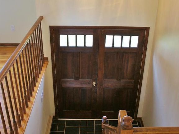Double wood doors with glass storm doors!