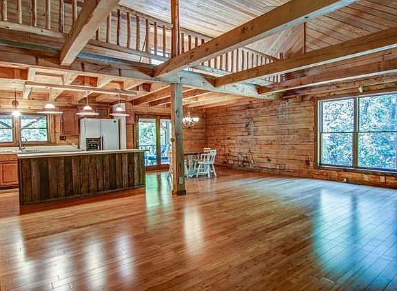 Great Room with Wood Beams warmly welcomes you....