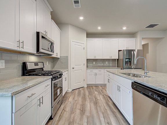 Kitchen outfitted with designer-curated finishes.