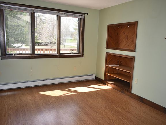 Living room with built-ins and laminate wood floors