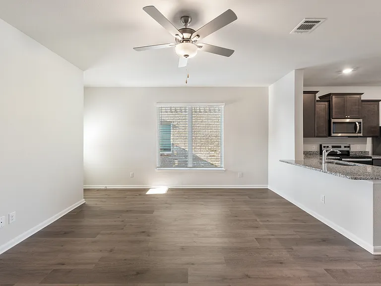 The family room has a large window that lets in great, natural light.