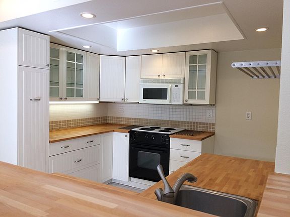 Remodeled open-plan, all-electric kitchen with pantry