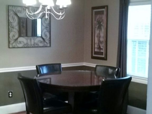 Dining Room: Arched entryway, hardwood floors, updated lighting  fixtures 
