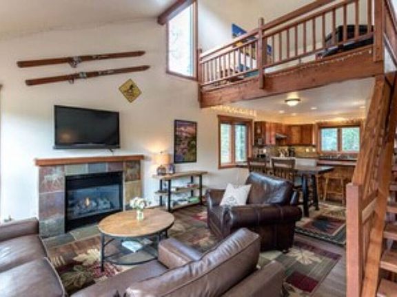 View of living area, dining area, and kitchen